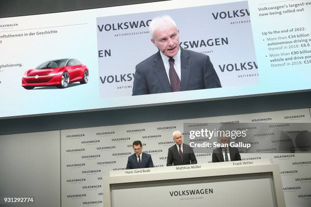 Matthias Mueller , Chairman of German automaker Volkswagen AG, VW Chief Financial Officer Frank Witter and Communications Director Hans-Gerde Bode...