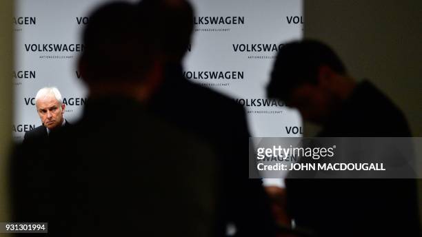 Matthias Mueller , CEO of German car maker Volkswagen , attends his company's annual press conference in Berlin on March 13, 2018. Volkswagen holds...
