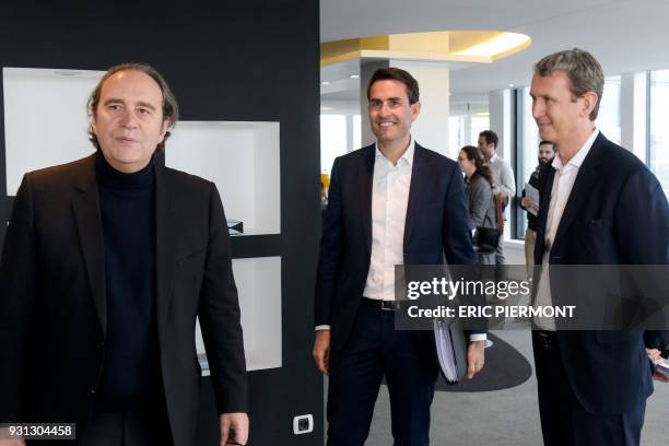 Iliad Group founder and Vice President Xavier Niel, CFO Thomas Reynaud and CEO Maxime Lombardini arrive for a press conference to present the group's...