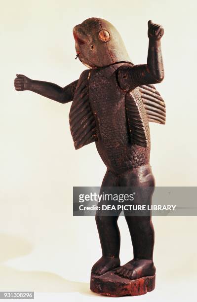Dahomey king with a shark's head, painted wood sculpture, Benin civilization.