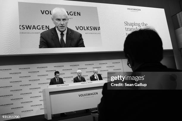 Matthias Mueller , Chairman of German automaker Volkswagen AG, VW Chief Financial Officer Frank Witter and Communications Director Hans-Gerde Bode...
