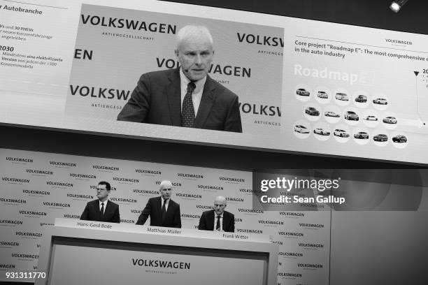 Matthias Mueller , Chairman of German automaker Volkswagen AG, VW Chief Financial Officer Frank Witter and Communications Director Hans-Gerde Bode...