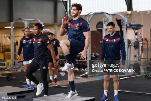 France rugby union national team player Maxime Machenaud warms up prior to take part in a weight-lifting session, on March 13, 2018 in Marcoussis, as...