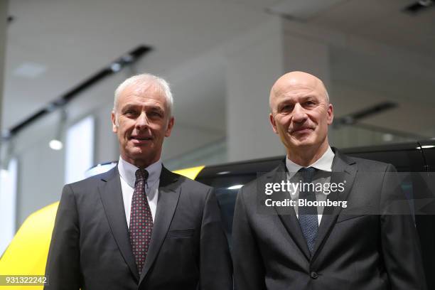 Matthias Mueller, chief executive officer of Volkswagen AG , left, and Frank Witter, chief financial officer of Volkswagen AG , pose for a photograph...