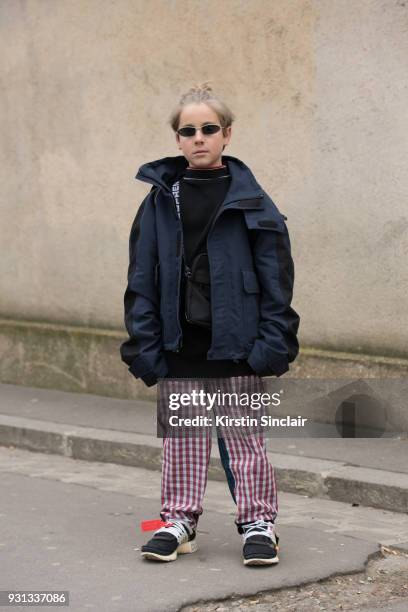 Fashion blogger Ivan Zinko wears a Balenciaga jacket, Nike for Off White trainers and Gosha Rubchinskiy trousers day 2 of Paris Womens Fashion Week...