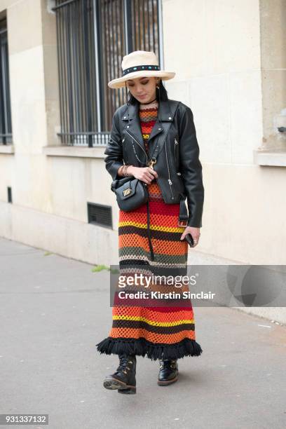 Model and fashion blogger Kiwi Lee han wears a Dior dress, boots, bag and jacket day 2 of Paris Womens Fashion Week Spring/Summer 2018, on February...