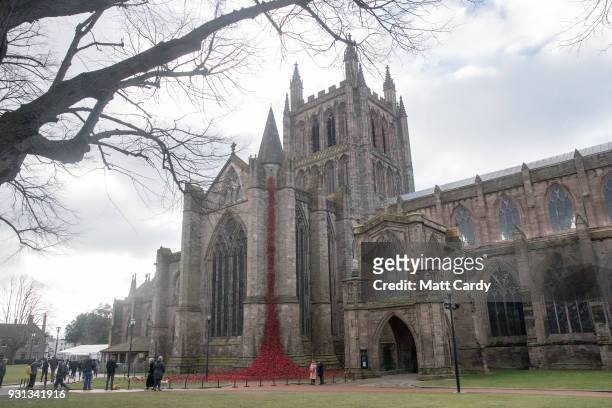 People stop to look as the Weeping Window opens at Hereford Cathedral as part of the final year of the 14-18 NOWs UK-wide tour of the poppies on...