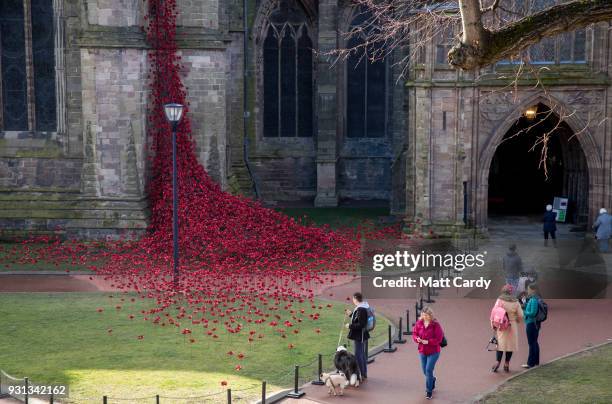 People stop to look as the Weeping Window opens at Hereford Cathedral as part of the final year of the 14-18 NOWs UK-wide tour of the poppies on...