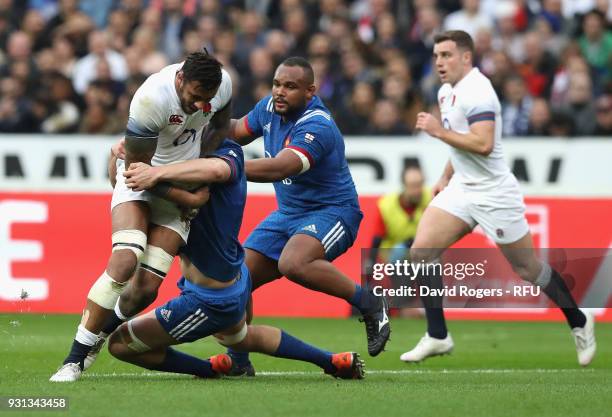 Courtney Lawes of England is tackled during the NatWest Six Nations match between France and England at Stade de France on March 10, 2018 in Paris,...