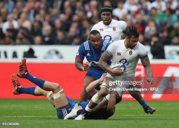 Courtney Lawes of England is tackled during the NatWest Six Nations match between France and England at Stade de France on March 10, 2018 in Paris,...