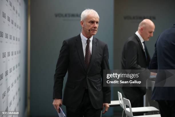 Matthias Mueller, Chairman of German automaker Volkswagen AG, departs after attending the company's annual press conference on March 13, 2018 in...