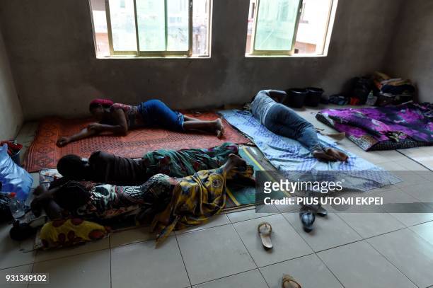 Lassa fever patients secondary contact and family members of Lassa fever victims lie on the floor at the Institute of Lassa Fever Research and...