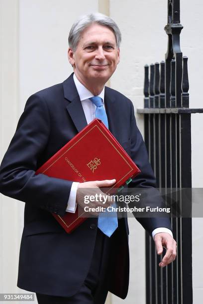 Chancellor Philip Hammond leaves number 11 Downing Street to present the Spring Statement in Parliament on March 13, 2018 in London, England.