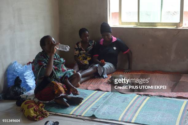 Lassa fever secondary contact and family members of victims lie on the floor at the Institute of Lassa Fever Research and Control in Irrua Specialist...