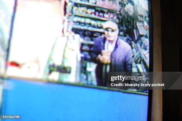 a senior man on cctv. - surveillance camera stock pictures, royalty-free photos & images