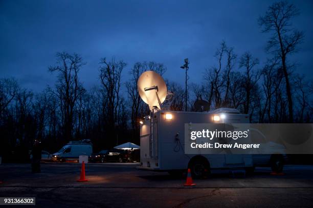 Satellite truck is parked before Conor Lamb, Democratic congressional candidate for Pennsylvania's 18th district, arrives at his polling station at...