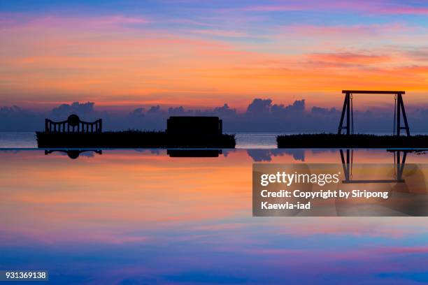 pool reflection of beautiful sky during sunrise. - copyright by siripong kaewla iad stock pictures, royalty-free photos & images