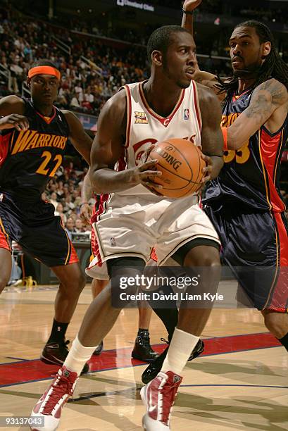 Hickson of the Cleveland Cavaliers looks to shoot against Anthony Morrow and Mikki Moore of the Golden State Warriors on November 17, 2009 at The...