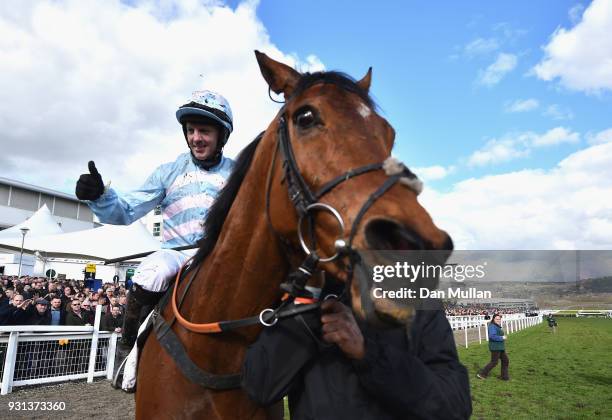 Summerville Boy ridden by Noel Fehily celebrates after winning the Sky Bet Supreme Novice Hurdle on Champion Day of the Cheltenham Festival at...