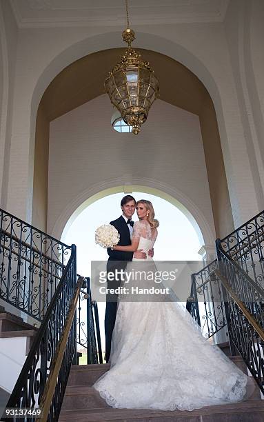 In this handout image provided by Ivanka Trump and Jared Kushner, Ivanka Trump and Jared Kushner attend their wedding at Trump National Golf Club on...
