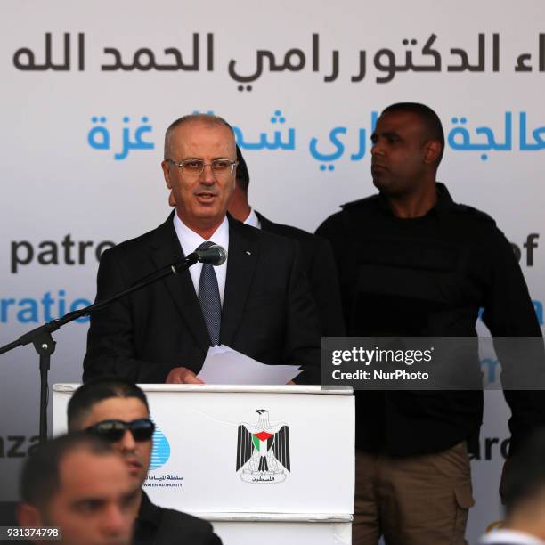 Palestinian Prime Minister Rami Hamdallah delivers a speech during opening of the desalination plant after he escaped unhurt an explosion struck near...