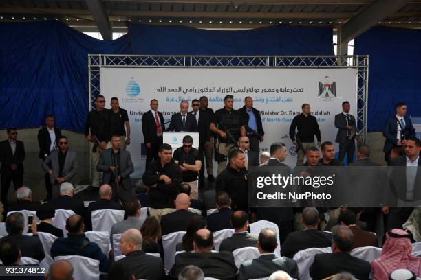 Palestinian Prime Minister Rami Hamdallah delivers a speech during opening of the desalination plant after he escaped unhurt an explosion struck near...