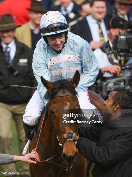 Cheltenham , United Kingdom - 13 March 2018; Jockey Noel Fehily celebrates as he enters the winners' enclosure after winning the Sky Bet Supreme...