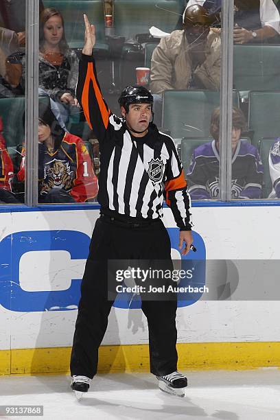 Referee Stephane Auger signals a delayed penalty against the Los Angeles Kings during the third period of the game against the Florida Panthers on...