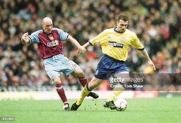 David Unsworth of Everton holds off Steve Stone of Villa during the match between Aston Villa v Everton in the FA Carling Premiership at Villa Park,...