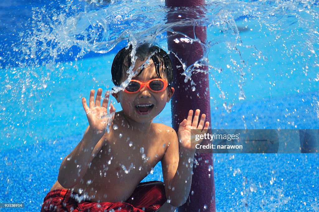 Boy under water spray