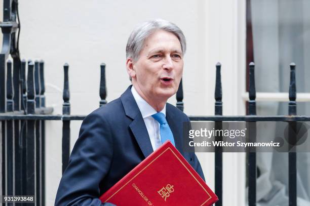 Chancellor of the Exchequer Philip Hammond leaves Downing Street in central London to announce the Spring Statement in the House of Commons on March...