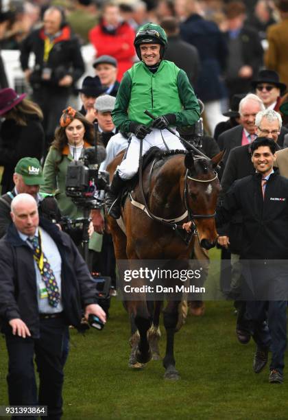 Footpad ridden by Ruby Walsh celebrates victory in the Racing Post Arkle Challenge Trophy Novices' Chase on Champion Day of the Cheltenham Festival...