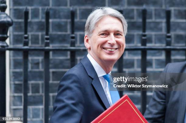 Chancellor of the Exchequer Philip Hammond leaves Downing Street in central London to announce the Spring Statement in the House of Commons on March...