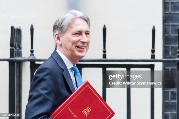 Chancellor of the Exchequer Philip Hammond leaves Downing Street in central London to announce the Spring Statement in the House of Commons on March...