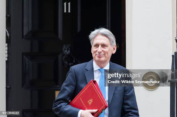 Chancellor of the Exchequer Philip Hammond leaves Downing Street in central London to announce the Spring Statement in the House of Commons on March...