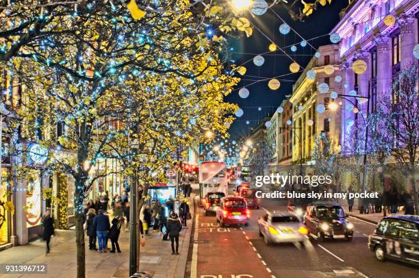 christmas shopping in oxford street. - oxford street christmas stock pictures, royalty-free photos & images