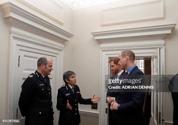 Britain's Prince Harry and Britain's Prince William, Duke of Cambridge, talk with Metropolitan Police Commissioner Cressida Dick and Police commander...