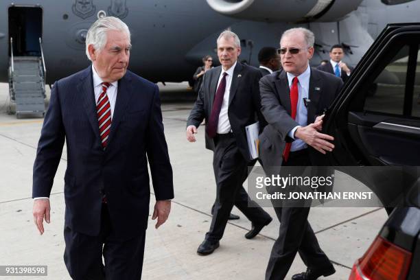 Secretary of State Rex Tillerson is shown to his car as he arrives at Jomo Kenyatta International Airport in Nairobi, on March 9, 2018. US President...