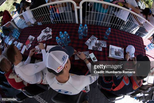 Kris Meeke and Paul Nagle from Citroen Abu Dhabi WRT Team and Daniel Sordo and Carlos del Barrio from Hyundai Shell Mobis WRC Team sign autographs...