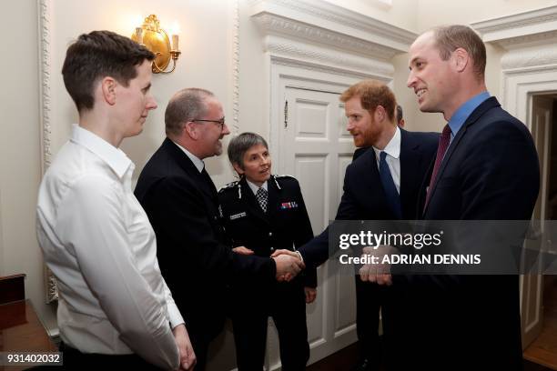 Britain's Prince William, Duke of Cambridge and Britain's Prince Harry talk Metropolitan Police Commissioner Cressida Dick police officer of the year...