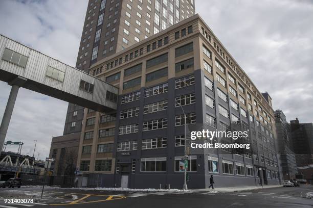 Pedestrian walks past the 175 Pearl building in the Dumbo neighborhood of the Brooklyn borough of New York, U.S., on Thursday, March 8, 2018. Two...