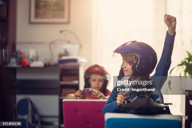 brother and sister playing car racing indoors - kid playing car imagens e fotografias de stock