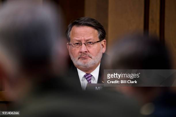 Sen. Gary Peters, D-Mich., questions Army Gen. Joseph Votel, commander of the United States Central Command, and Marine Corps Gen. Thomas Waldhauser,...