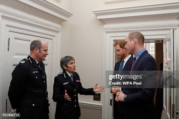 Prince William, Duke of Cambridge and Prince Harry talk with Metropolitan Police Commissioner Cressida Dick and Police commander Stuart Cundy as they...