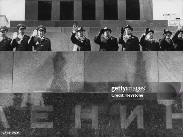 From left to right, in centre, Soviet leaders Alexei Kosygin, Leonid Brezhnev and Mikhail Suslov wave from Lenin's Mausoleum on Red Square in Moscow,...
