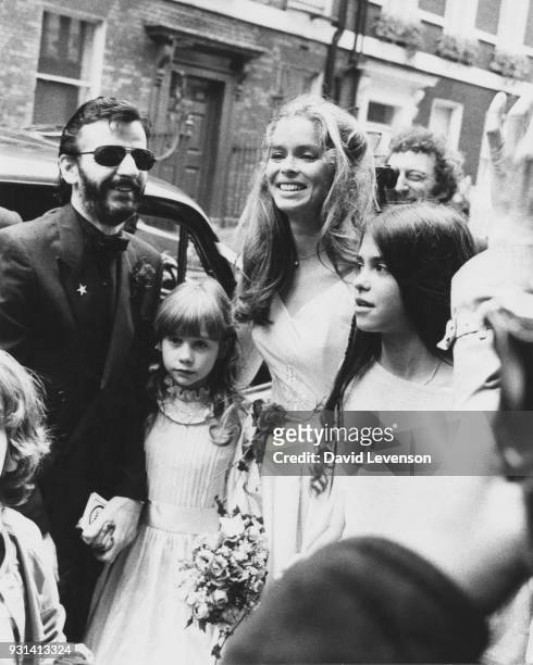 Drummer Ringo Starr, formerly of British rock group the Beatles, and his new bride, actress Barbara Bach after their wedding in London, 27th April...