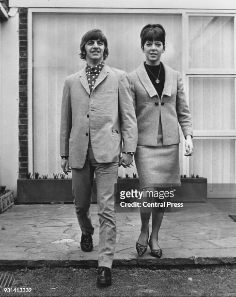 Drummer Ringo Starr of British rock group the Beatles with his new bride, Maureen Cox, at a bungalow in Hove the day after their wedding, 12th...