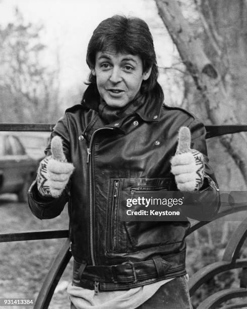 Musician Paul McCartney gives a thumbs up to the press at his farmhouse near Rye, Sussex, after being deported from Japan for bringing drugs into the...