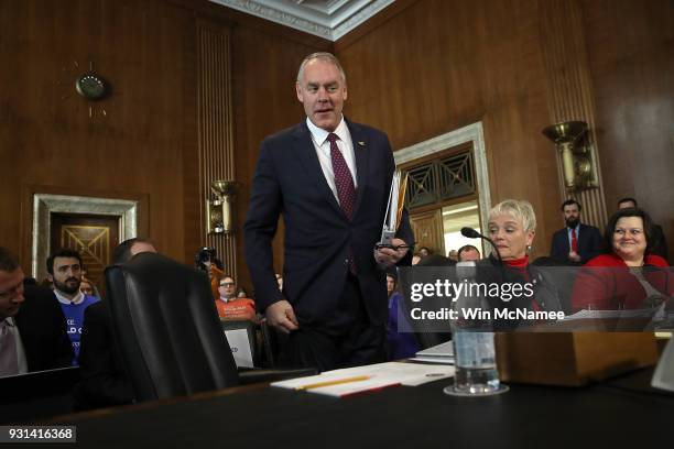 Interior Secretary Ryan Zinke arrives for testimony before the Senate Energy and Natural Resources Committee March 13, 2018 in Washington, DC. Zinke...