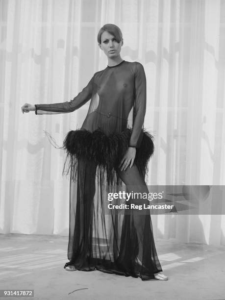 Fashion model wearing Yves Saint Laurent see though long dress, Paris, France, 19th August 1968.